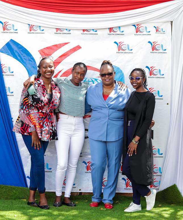 Team members at the Youth Concern banner
